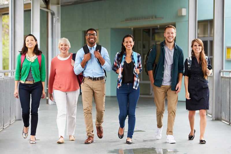 group-of-university-tutors-walking